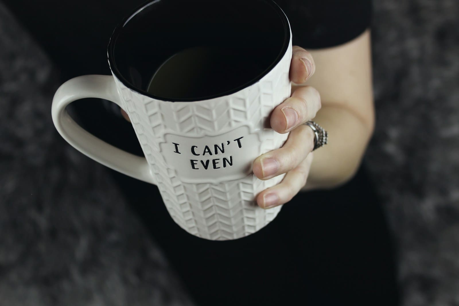a woman's hand grasps a white and black mug that says " I Can't Even" Hormonal imbalances and liver health concerns can ruin your day doesn't fit on the mug