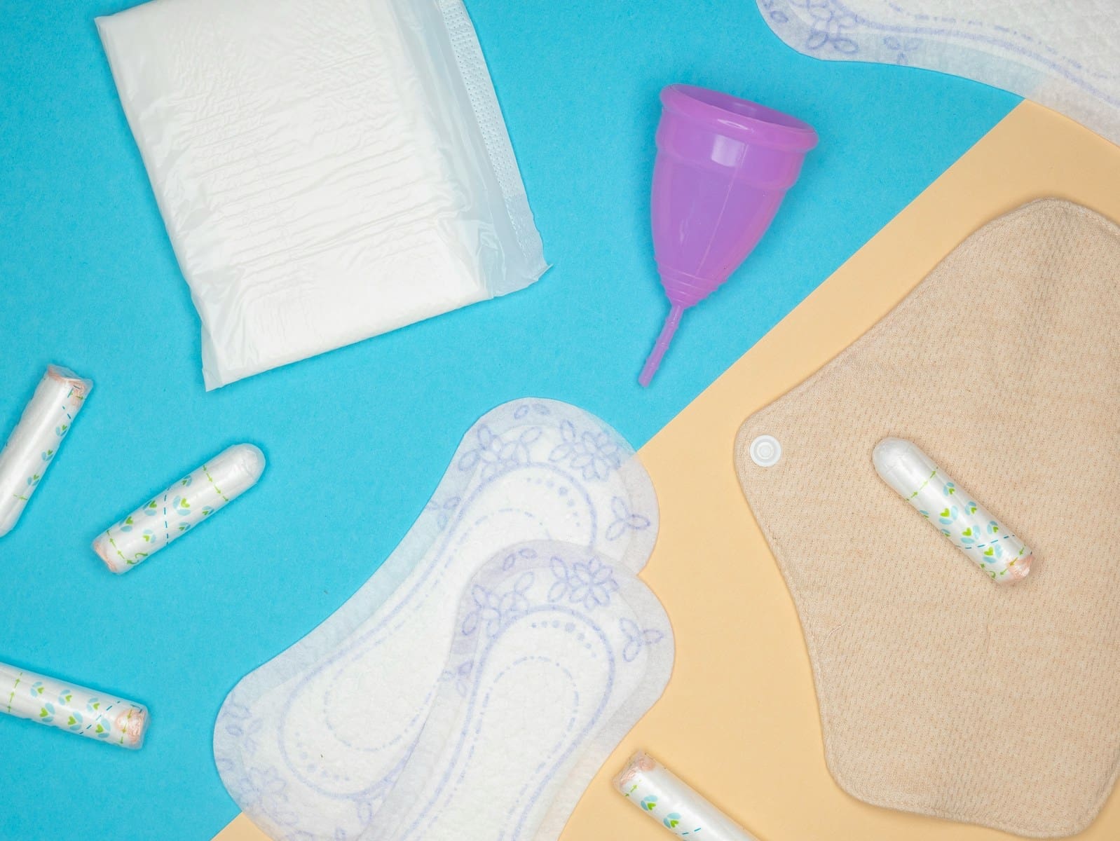 an assortment of baby products laid out on a blue background
