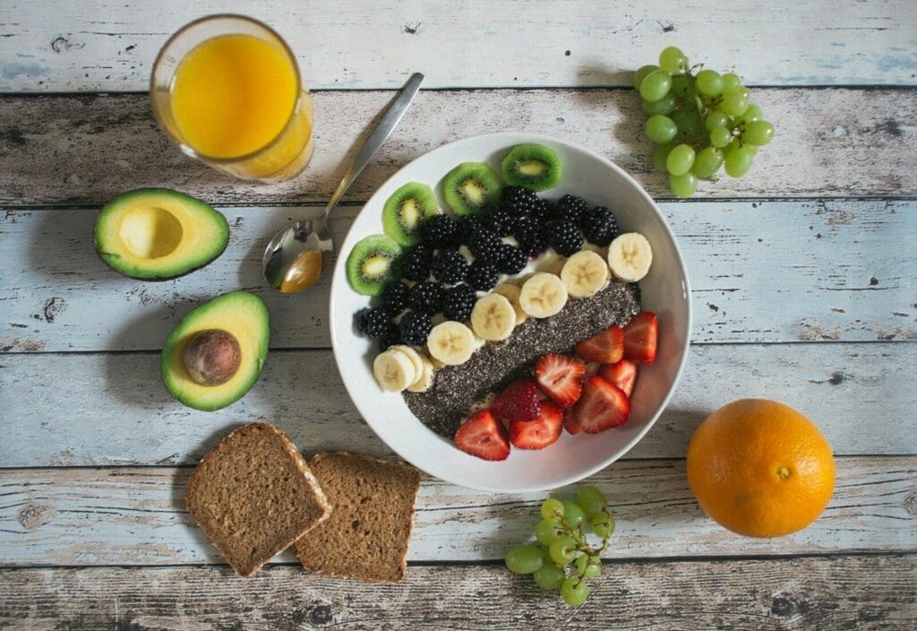 fruit lot on ceramic plate. high fiber foods boost GLP 1 naturally